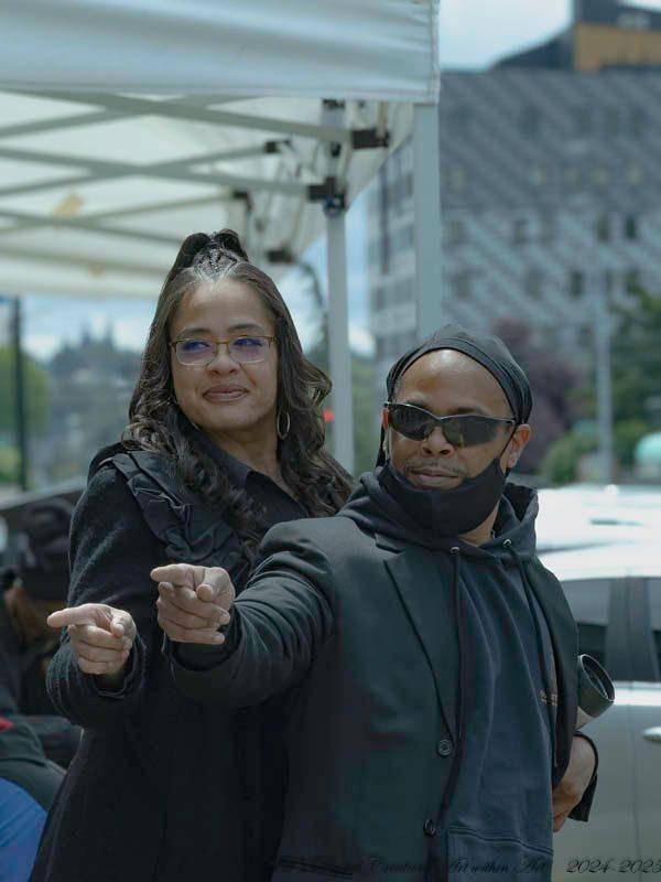 A man and woman standing next to each other.